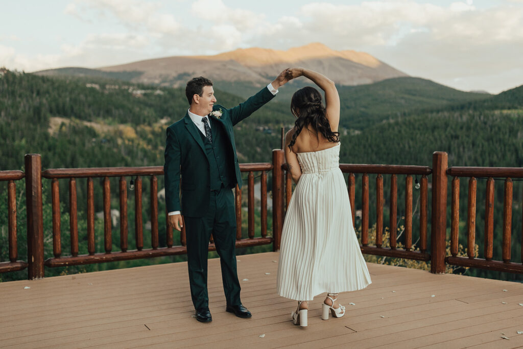 Bride and groom dance on the deck of The Lodge at Breckenridge