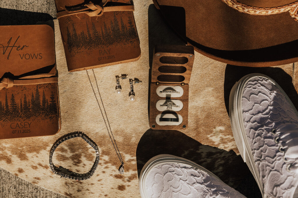 Western elopement details sitting on cowhide