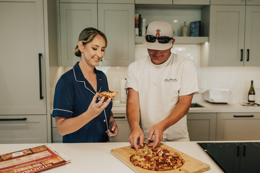 Bride and groom make pizza before their Colorado elopement ceremony