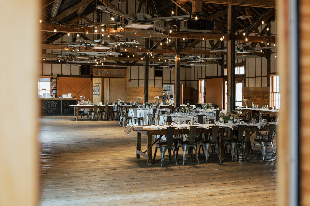 Inside the barn wedding reception space at FREIGHT Leadville