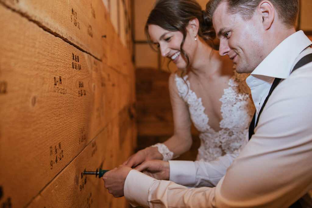 Bride and groom brand their initials into wood at FREIGHT