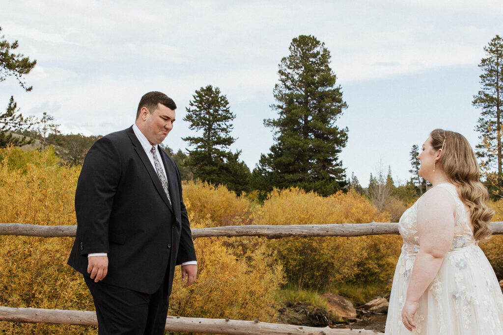 Bride and groom first look at Beaver Meadows Resort Ranch in Colorado