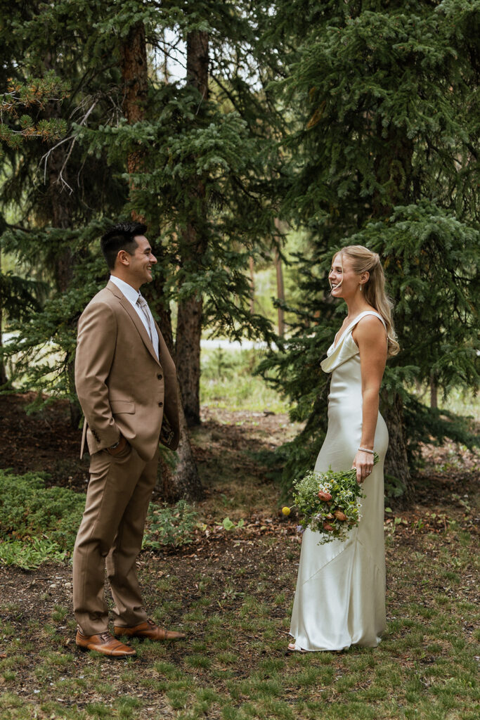 Colorado wedding photos in the woods with wildflower bouquet