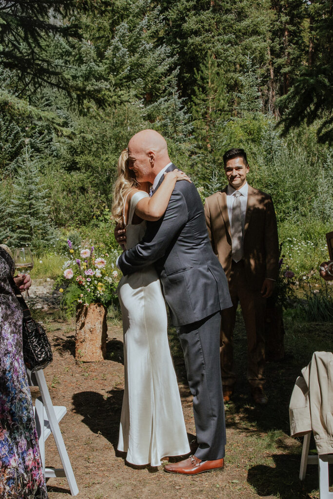 Breckenridge, Colorado micro wedding ceremony in the woods by the river