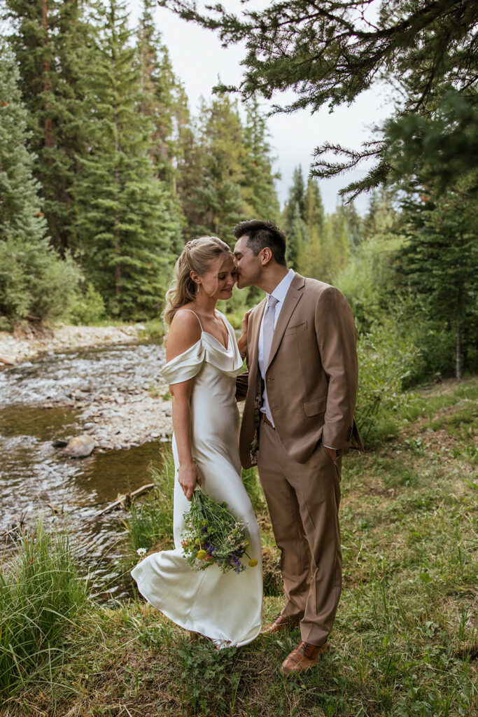 Riverside bride and groom portraits in Breckenridge